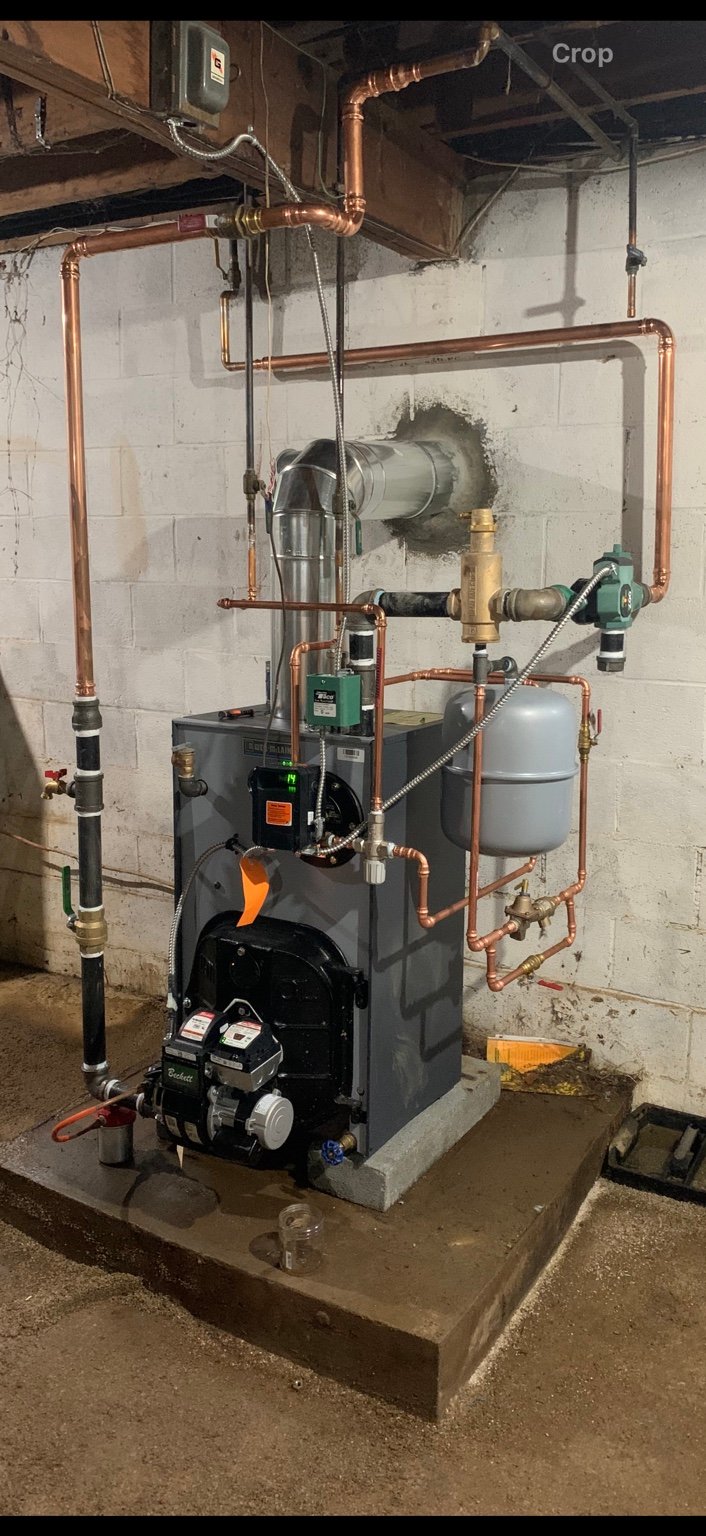 Oil-fired hydronic boiler with copper piping and circulation controls installed by TrueField Home Services in Delaware County, PA