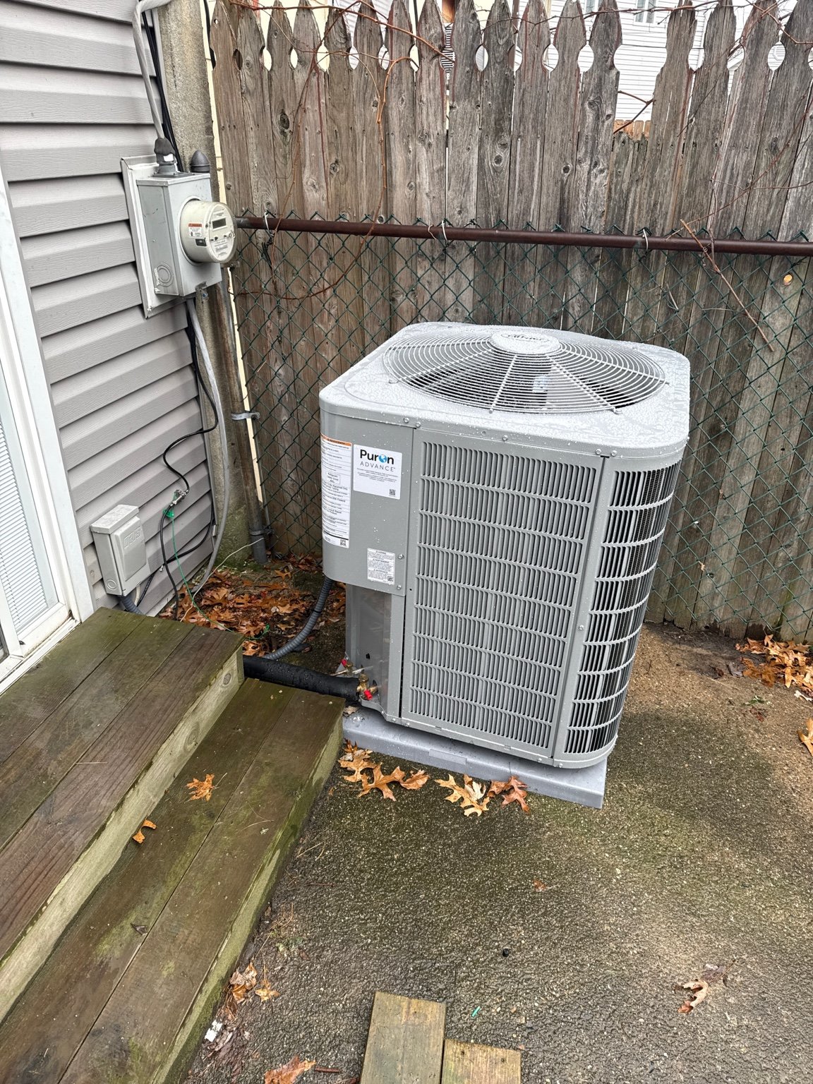 Residential air-conditioning condenser installed on a level equipment pad by TrueField Home Services in Delaware County, PA