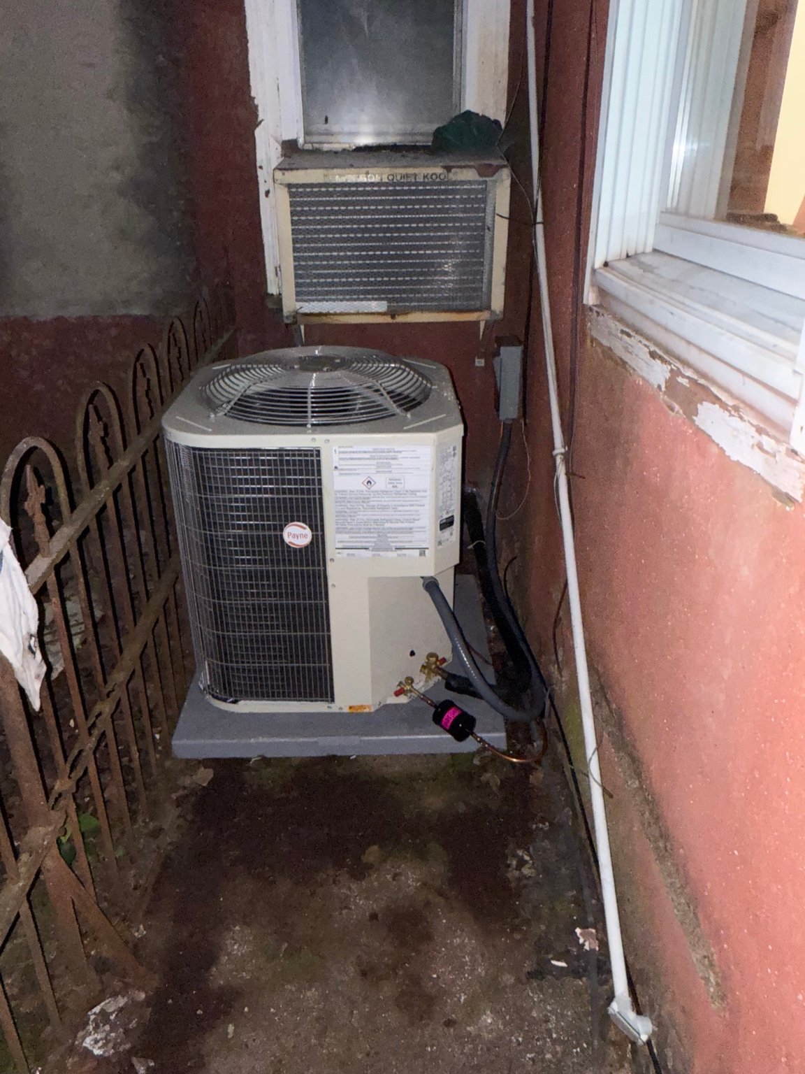 Payne air-conditioning condenser installed in a narrow side-yard space by TrueField Home Services in Delaware County, PA