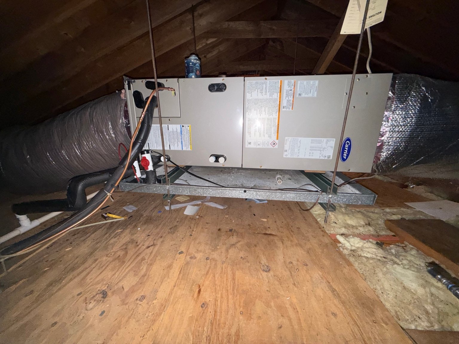 Carrier heat-pump air handler installed and suspended in an attic by TrueField Home Services in Delaware County, PA