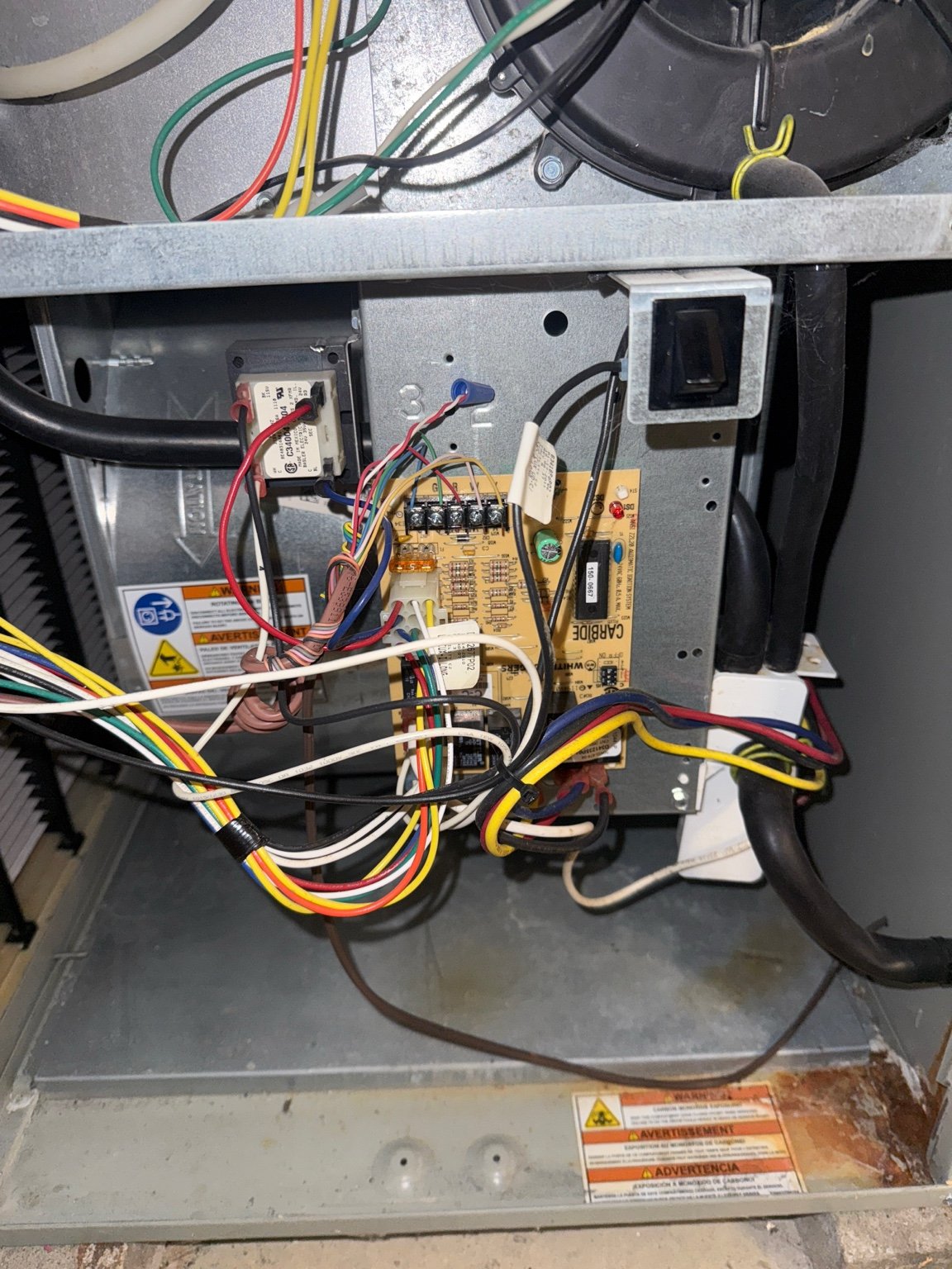 HVAC furnace control board wiring being diagnosed by TrueField Home Services